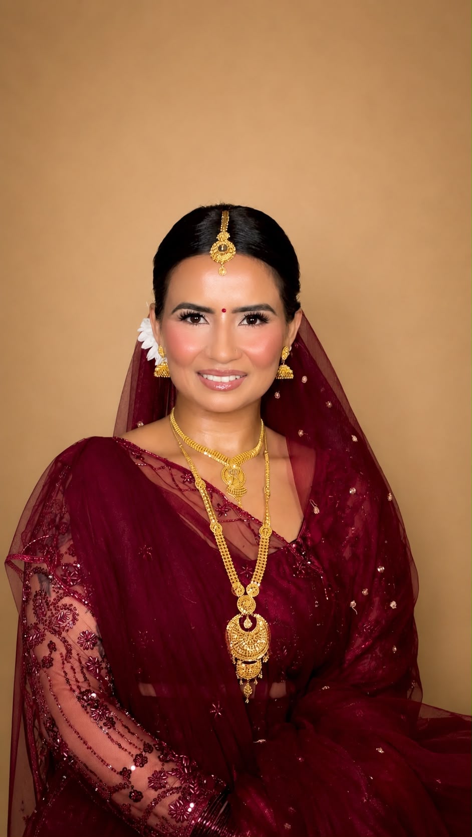 Maroon saree bridal with gold jewellery